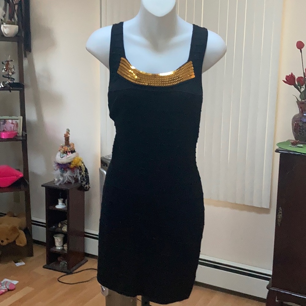 Black dress with gold sequin neckline trim